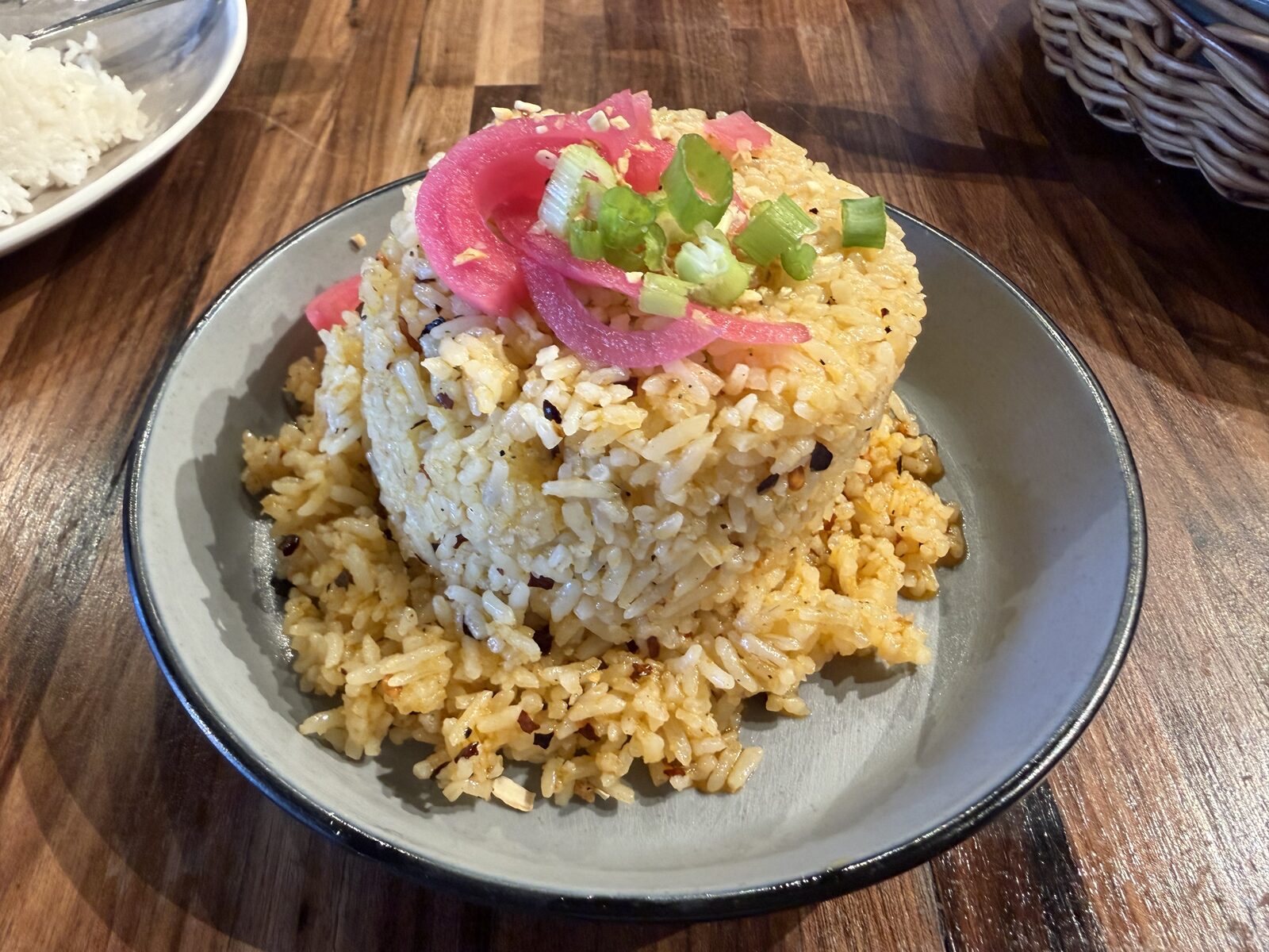 Spicy Garlic Fried Rice from Only at Renee's, topped with pickled red onions and green onions