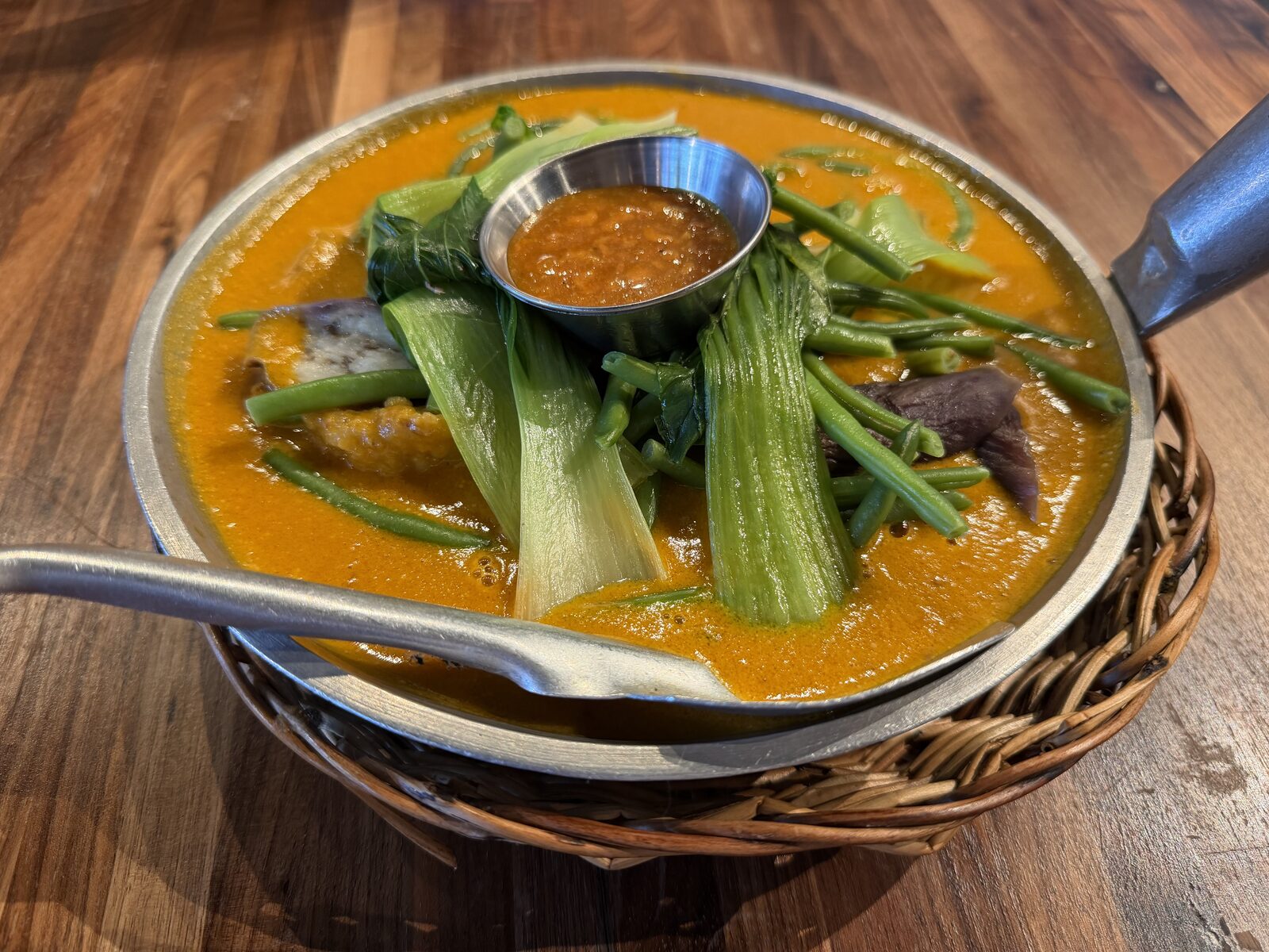 Oxtail Kare-Kare from Only at Renee's, in a thick peanut sauce with bok choy, green beans, and shrimp paste on the side